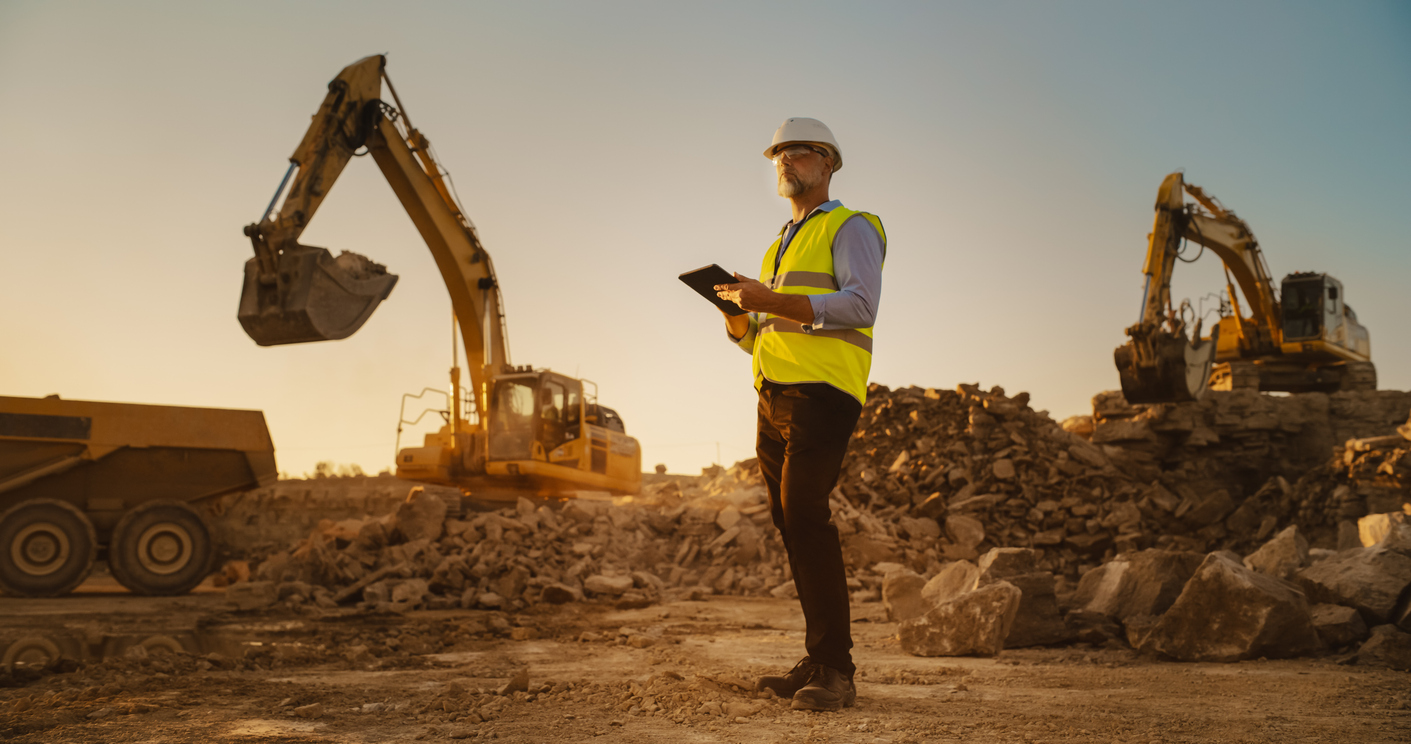 Workers enhancing soil conditions at a construction site